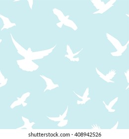 Vector seamless background. The flight of the birds. A set of silhouettes. Heavenly pattern. The sky and birds