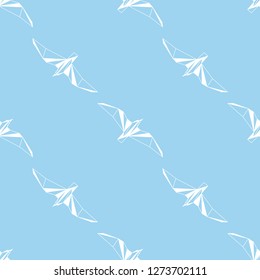Vector seamless background with flying seagulls. Modern polygonal  design. Origami birds. Flat design pattern 