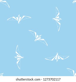 Vector seamless background with flying seagulls. Modern polygonal  design. Origami birds. Flat design pattern 