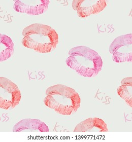 Vector seamless background. lip prints and the inscription kiss. Print natural lip prints.