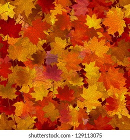 Vector seamless background: a lot of maple autumn leaves on the ground.