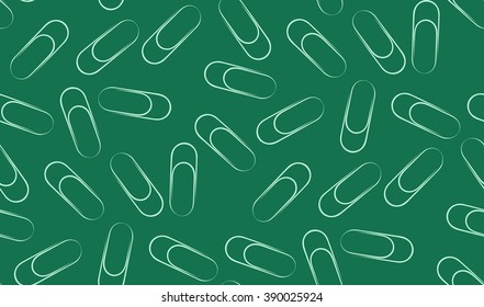 Vector seamless background of paperclips. Randomly located paper clip