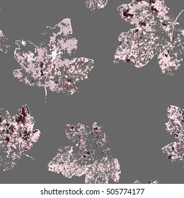 Vector seamless background pattern with autumn (fall) maple leaves. Imprint textile with pink leaves on gray background