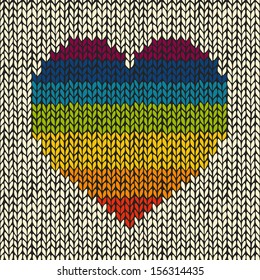 Vector seamless background with rainbow knitted heart 