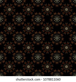 Vector seamless background. Winter background with yellow, orange and brown snowflakes.