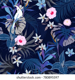 Vector seamless beautiful artistic summer dark tropical pattern with exotic forest. Bright and Colorful original stylish floral background print, bright forest flower on navy blue background. Vector seamless beautiful artistic summer dark tropical pattern with exotic forest. Bright and Colorful original stylish floral background print, bright forest flower on navy blue background.