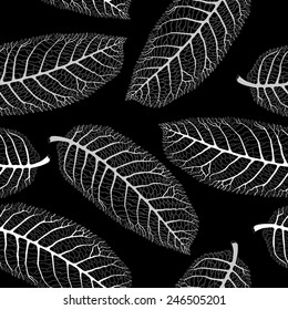 Vector seamless black and white pattern with  lace walnut leaves on black background
