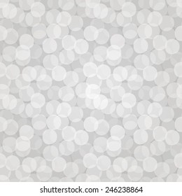Vector seamless bokeh pattern of white overlapped transparent circles. Design of holiday gift wrapping, greeting card or web page wallpaper. EPS10 repetitive vintage background.