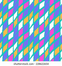 Vector seamless bold harlequin pattern colorful hand painted diamond shapes in bright multiple colors blue, turquoise, violet, pink, yellow, white for fall winter retro fashion