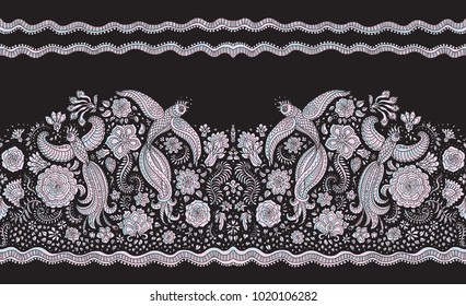 Vector seamless border in ethnic style. Exotic flying peacock birds, light pearl colored folk ornaments on a black background. Embroidery edge, wallpaper fringe, textile print, wrapping paper