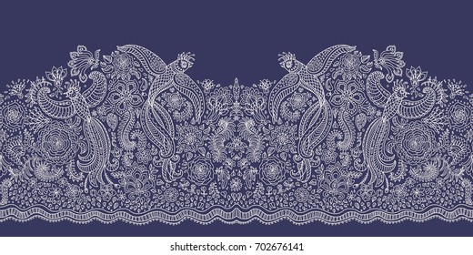 Vector seamless border in ethnic style.Exotic flying birds, beige contour thin line drawing with folk ornaments on a dark indigo blue background. Embroidery, wallpaper, textile print, wrapping paper