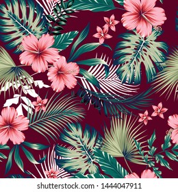 vector seamless botanical tropical pattern with flowers. Lush foliage floral design with monstera leaves, areca palm leaves, fan palm, hibiscus flower, frangipani flower. Modern allover background.