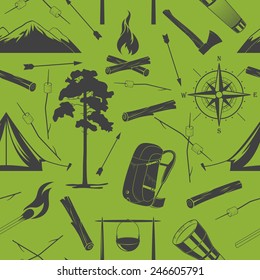Vector seamless camping pattern on a green background