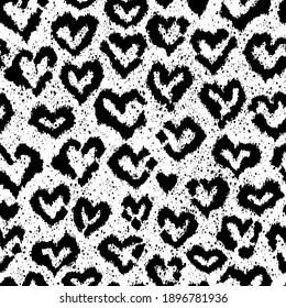 Vector seamless cheetah pattern with heart-shaped spots. Romantic repeated texture with snow leopard print. Animal print for fabric and wrapping paper. Leopard print. Black and white background.