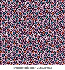 Vector seamless cheetah pattern in rainbow colors. Wild repeated texture with leopard print. Colorful artistic background. Bright colored animalistic print with pink background