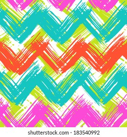 Vector seamless chevron pattern hand painted with bold brushstrokes in bright multiple colors: turquoise, lime green, orange, pink and white