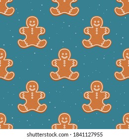 Vector seamless Christmas and new year pattern with gingerbread man and snowflakes on a dark background