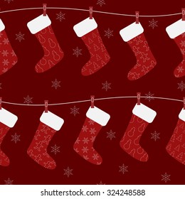 Vector seamless Christmas pattern. Red decoration socks hang on white rope. Can be used in fabric, wrapping, cards design.