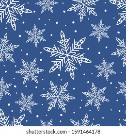 Vector seamless Christmas pattern with white snowflakes isolated on blue background. Can be used for design of gift wrap,textile,blog decoration,banner,poster,website,wallpapers and greeting card