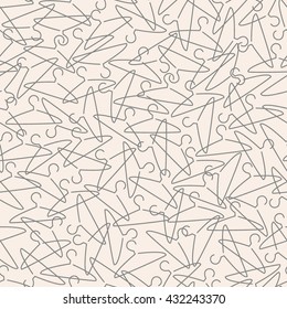 Vector seamless clothes hanger pattern on a pink background. Textile print