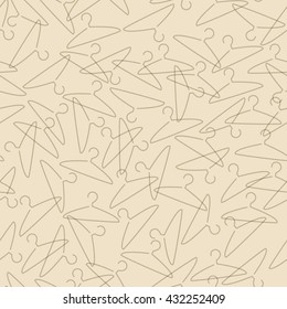 Vector seamless clothes hanger pattern on a beige background. Textile fabric print