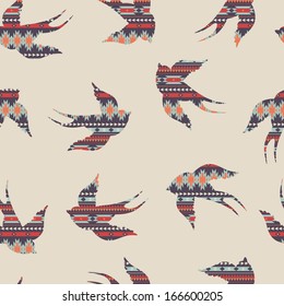 Vector seamless colorful decorative ethnic pattern with swallows