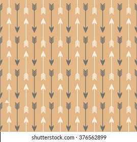 Vector seamless colorful ethnic pattern with arrows. Seamless pattern in native american style.Tribal arrows on brown kraft background