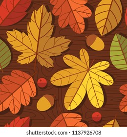 Vector seamless colorful pattern of autumn leaves over wooden texture background. Design of a repeat tile for printing on fabric, postcards and flyers. Floral ornament with tree leaves and berries