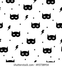 Vector seamless cute background with a pattern of mask bat, stars and lightning. Black and white color. Printing fabric textile. Vector cute illustration for boy