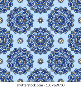 Vector seamless decorative pattern with round floral and geometric ornament. Repeating embellished tiles with mandala. Indian or Arabic motive. Boho festival style.