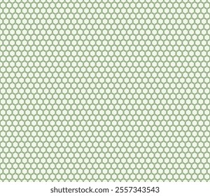 Vector seamless design. Green color on matching background. Bold rounded hexagons mosaic pattern. Regular hexagon shapes. Seamless design. Tileable vector illustration.