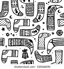 Vector seamless doodle black and white pattern of different Christmas boot