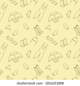 Vector seamless endless pattern with Doodle illustrations of children's winter clothing. A set of warm clothes for winter and autumn. Background for packaging paper, textiles, and tailoring.