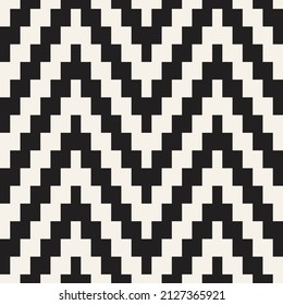Patrón de punto étnico sin fisuras del vector. El zigzag geométrico repetitivo recorrió la textura de las líneas. Diseño textil monocromo elegante.
