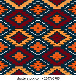 Vector seamless ethnic pattern with american indian motifs in multiple colors. Colorful aztec background. Textile print with navajo tribal ornament. Native american art.