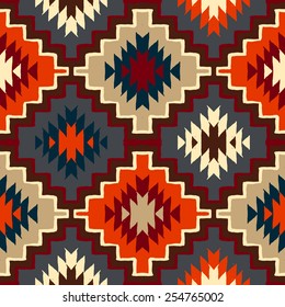 Vector seamless ethnic pattern with american indian motifs in multiple colors. Colorful aztec background. Textile print with navajo tribal ornament. Native american art.