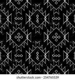 Vector seamless ethnic pattern with american indian motifs in black and white colors. Aztec background. Textile print with navajo tribal ornament. Native american art.