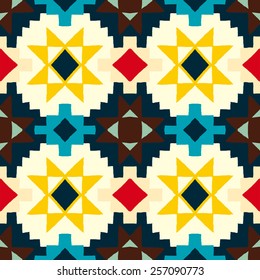Vector seamless ethnic pattern with american indian motifs in multiple colors. Colorful aztec background. Textile print with navajo tribal ornament. Native american art.