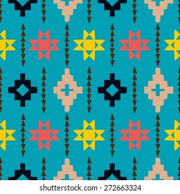 Vector seamless ethnic pattern with american indian motifs in multiple colors. Colorful aztec background. Textile print with navajo tribal ornament. Native american art.