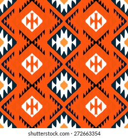 Vector seamless ethnic pattern with american indian motifs in multiple colors. Colorful aztec background. Textile print with navajo tribal ornament. Native american art.