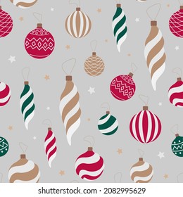 Vector seamless festive pattern. Flat gold, red and green Christmas toys isolated on gray background.
