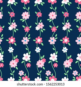 Vector seamless floral pattern with pink flowers and green leaves on dark blue background