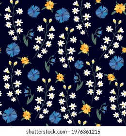 vector seamless floral pattern. White small flowers, blue and yellow flowers.
