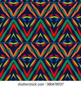Vector seamless geometric pattern with ethnic and tribal motif. Bright bold print with chevrons, zig zag, line and stripe in native embroidery style. Hand drawn colorful red, blue, green background 