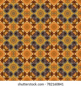 Vector seamless geometric pattern of orange, yellow and brown tiles.