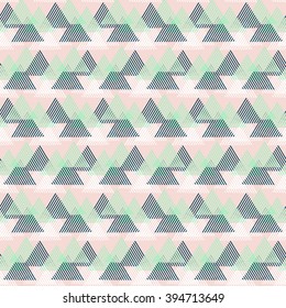 Vector seamless geometric pattern with striped triangles, abstract dynamic shapes in pink, green, white colors. Hand drawn background with lines in 1990s fashion style. Modern techno textile print.