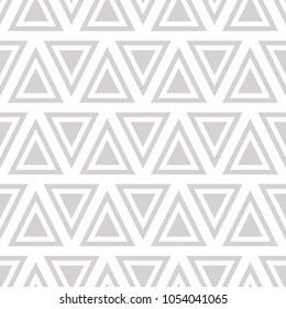 Vector seamless geometric pattern with triangles in gray color
