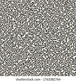 Vector seamless grainy pattern. Abstract background with tiny rough spots. Monochrome noisy texture. Randomly disposed sloppy organic mottle.