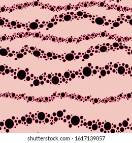 vector seamless graphical irregular polka dot pattern organized in waving horizontal lines. 