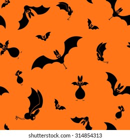 Vector seamless halloween bats silhouette on orange background
